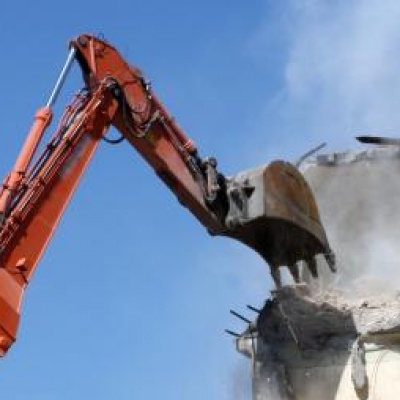 Digger demolishes building in site clearance operation